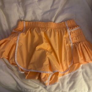 Vibrant Orange Athletic Shorts with Flared Trim